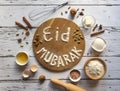 Eid Mubarak - Islamic holiday welcome phrase ` happy holiday`, greeting reserved. Arabic cuisine background.