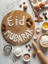 Eid Mubarak - Islamic holiday welcome phrase ` happy holiday`, greeting reserved. Arabic cuisine background.