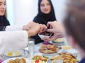 Muslim family having Iftar dinner eating dates to break feast Royalty Free Stock Photo