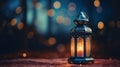 Eid Mubarak and Ramadan Kareem Islam holy month. Arabic lantern and burning candle at night. Muslims iftar under soft light of Royalty Free Stock Photo