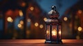 Eid Mubarak and Ramadan Kareem Islam holy month. Arabic lantern and burning candle at night. Muslims iftar under soft light of Royalty Free Stock Photo