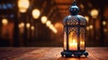 Eid Mubarak and Ramadan Kareem Islam holy month. Arabic lantern and burning candle at night. Muslims iftar under soft light of Royalty Free Stock Photo