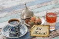 Eid mubarak text on greeting card with turkish coffee, delights Royalty Free Stock Photo