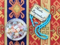 Eid mubarak text in turkish on the card with blue rosary Royalty Free Stock Photo