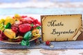 Eid mubarak in turkish on the card with colorful candies on vintage table Royalty Free Stock Photo