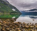 Eidfjord, a Norwegian town and municipality in the Hordaland region, view from the beach on the Eid fjord, the inner branch of the