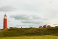 Panoramic landscape with the lighthouse of Cocksdorp with grass dunes in the forground, Nationalpark Duinen van Texel, Texel islan Royalty Free Stock Photo