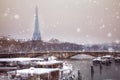 Eifel tower and bridge de l`Alma under snow, Paris Royalty Free Stock Photo