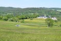 Curvy Mountain road above a village Royalty Free Stock Photo