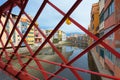 View of Girona through the bars of the Eiffel Bridge over the Onyar river, Catalonia, Spain