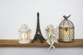 Eiffel statue, Bird cage with LED candle light and Fairy statue Home decoration accessories on wooden shelves