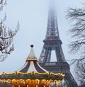 Eiffel Tower and antique carousel as seen at night in Paris, France