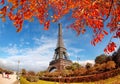 Eiffel Tower with autumn leaves in Paris, France