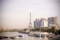 Eiffel tower behind the river of paris with boats Royalty Free Stock Photo