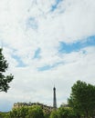 Eiffel tower behind trees and houses, Paris Royalty Free Stock Photo