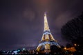 Eiffel Tower brightly illuminated at dusk