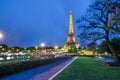 Eiffel Tower brightly illuminated at dusk, Paris