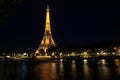 Eiffel Tower brightly illuminated at dusk in Paris