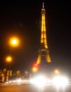 Eiffel Tower brightly illuminated at dusk in Paris