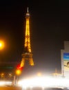 Eiffel Tower brightly illuminated at dusk in Paris