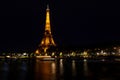 Eiffel Tower brightly illuminated at dusk in Paris