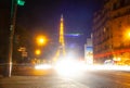 Eiffel Tower brightly illuminated at dusk in Paris