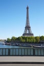 Eiffel tower and empty sidewalk bridge on Seine river