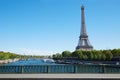 Eiffel tower and empty sidewalk bridge on Seine river in Paris