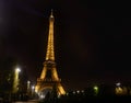 Eiffel tower with golden illumination by night in Paris Royalty Free Stock Photo