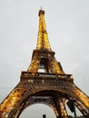 Eiffel Tower Illuminated Gold in the Fog Royalty Free Stock Photo