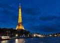 Eiffel tower illuminated at night with reflections on the Seine river, Paris, France Royalty Free Stock Photo