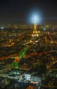 The Eiffel Tower illuminates buildings and roofs of Paris in the City of Lights, Pairs, LutÃ©cia Royalty Free Stock Photo