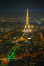 The Eiffel Tower illuminates the Invalide building and roofs of Paris in the City of Lights, Pairs, LutÃ©cia Royalty Free Stock Photo