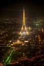 The Eiffel Tower illuminates the Invalide building and roofs of Paris in the City of Lights, Pairs, LutÃ©cia Royalty Free Stock Photo