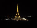 Eiffel Tower lit up against a black background