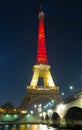 The Eiffel tower lit up with the colors of Belgian National flag Royalty Free Stock Photo