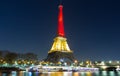 The Eiffel tower lit up with the colors of Belgian National flag Royalty Free Stock Photo