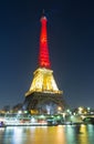 The Eiffel tower lit up with the colors of Belgian National flag Royalty Free Stock Photo