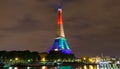 The Eiffel tower lit up with rainbow colors, Paris, France.