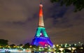 The Eiffel tower lit up with rainbow colors, Paris, France.
