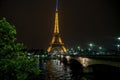 Eiffel tower at night across river Seine Royalty Free Stock Photo