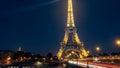 Eiffel Tower at Night with Dynamic Light Trails in Paris Royalty Free Stock Photo