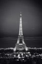 Eiffel Tower in night. Famous historical landmark on the quay of a river Seine. Romantic, tourist, architecture symbol