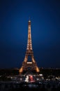 Eiffel Tower in night. Famous historical landmark on the quay of a river Seine. Romantic, tourist, architecture symbol