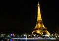 The Eiffel Tower At Night with the reflection of the Seine