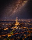 The Eiffel Tower at night under the Milky Way galaxy in Paris, France. Aerial view from Montparnasse Tower. Royalty Free Stock Photo