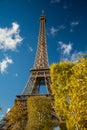 Eiffel Tower over blue sky and fall leaves Royalty Free Stock Photo