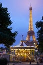 Eiffel tower in Paris and carousel in the evening Royalty Free Stock Photo