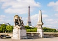 The Eiffel tower in Paris, France, with a lion sculpture in the foreground Royalty Free Stock Photo