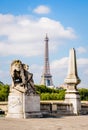 The Eiffel tower in Paris, France, with a lion sculpture in the foreground Royalty Free Stock Photo